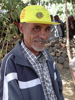 Volunteer with a Lions hat