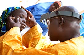 Dr. Kadri performs an eye exam.