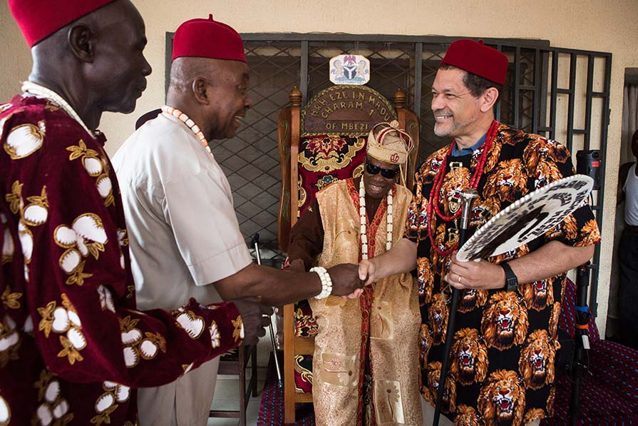 Frank Richards shakes hands with Nigerian man.