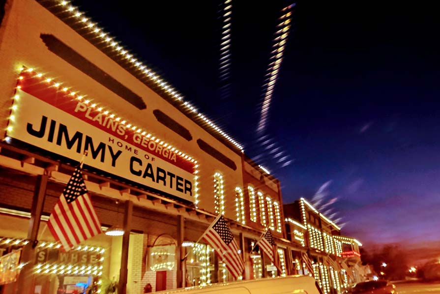 Photo of Main Street illuminated with orange light  in Plain, Ga.